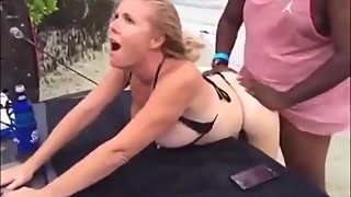 Hot slut wife blowing a hard cock on the beach